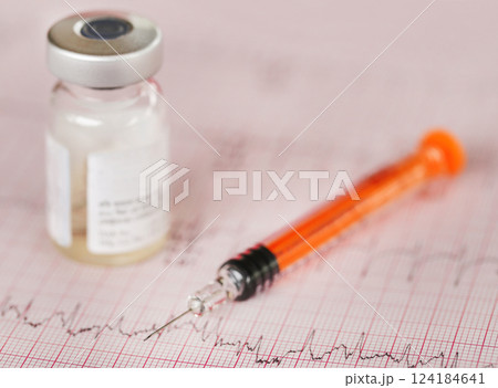Syringe vial on electrocardiograph Syringe vial on electrocardiograph 124184641