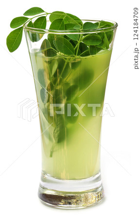 Moringa leaves with extract in a glass Moringa leaves with extract in a glass 124184709