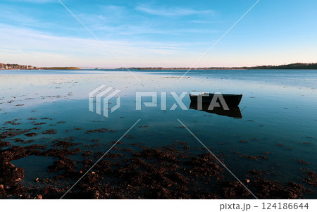 Lonely boat in Roskilde fjord of Denmark 124186644