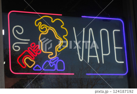 Neon Sign in Window of Vape Shop Neon Sign in Window of Vape Shop 124187192