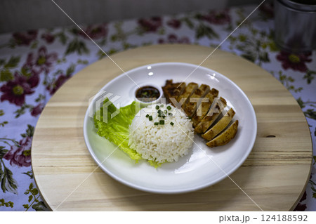 Steamed Rice And Grilled Meat On Plate 124188592