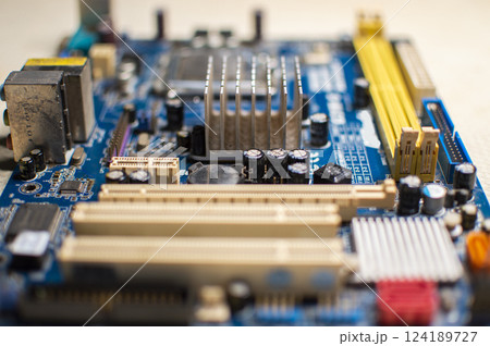 Close up of a motherboard, details of a computer motherboard, detail of a motherboard socket Close up of a motherboard, details of a computer motherboard, detail of a motherboard socket 124189727