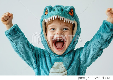 Young Boy Roaring in Dinosaur Costume with Excitement 124191748