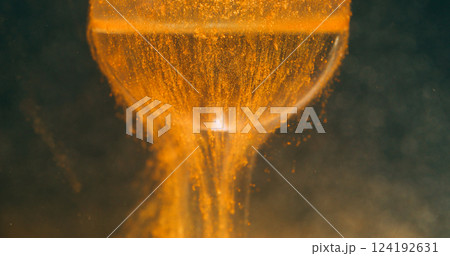 Dust ink texture. Ball background. Defocused yellow golden color water shiny light falling paint mist drip on abstract dark black art. 124192631