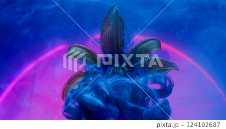 Smoke swirl. Paint water splash. Shimmering blue cloud on nature petal. Art fluid neon color abstract round purple arch defocused background. 124192687