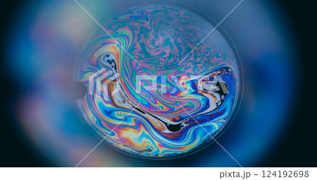 Holographic swirl. Spectrum oil mix. Round lens on blur color background. Abstract floating gasoline neon ink blend fluid black surface. Holographic swirl. Spectrum oil mix. Round lens on blur color background. Abstract floating gasoline neon ink blend fluid black surface. 124192698