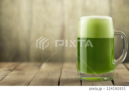 Green Beer on Wooden Background Green Beer on Wooden Background 124192831
