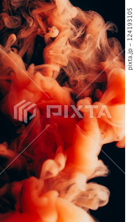 Pigment splash. Fume paint explosion. Orange vapor stream swirl mix shape on black background. Blur color haze abstract dye drop wave spill. Pigment splash. Fume paint explosion. Orange vapor stream swirl mix shape on black background. Blur color haze abstract dye drop wave spill. 124193105