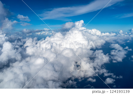 Aerial view of fluffy clouds over the Pacific Ocean in Polynesia 124193139