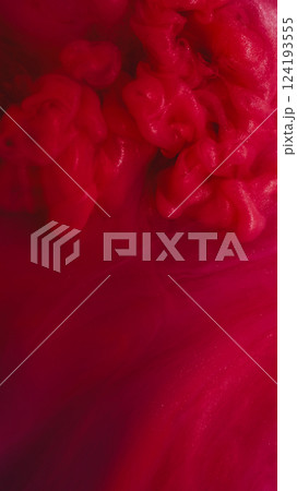 Sparkling fluid. Smoke flow. Red color water surface blend shimmering puff ink blow spray. Art vapor defocused abstract mystic background. 124193555