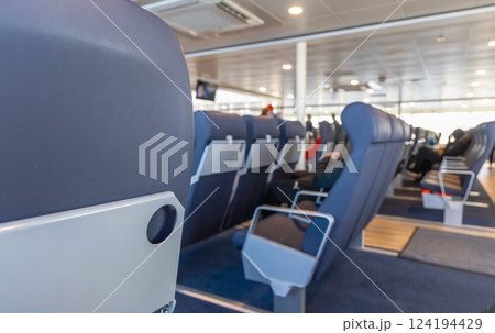 Empty passenger seats inside the ferry Empty passenger seats inside the ferry 124194429