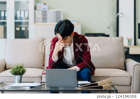 Stressed businessman working in the office. 124196308
