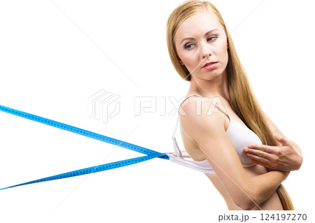 Woman wearing too big bra, loose band 124197270