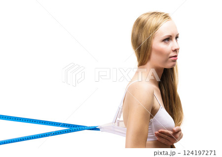 Woman wearing too big bra, loose band Woman wearing too big bra, loose band 124197271