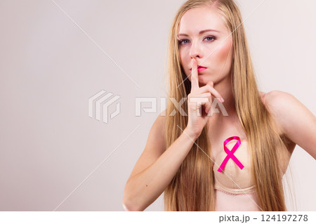 Woman pink cancer ribbon on breast 124197278