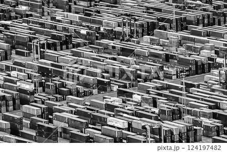 Aerial view over shipping containers stacked on a commercial port 124197482