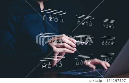 Online exam and survey completion concept. A person interacts with questionnaire, marking answers on an online interface, testing, knowledge quizzes, surveys, and task management. checkbox, checklist, Online exam and survey completion concept. A person interacts with questionnaire, marking answers on an online interface, testing, knowledge quizzes, surveys, and task management. checkbox, checklist, 124197597
