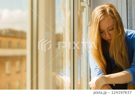 Young teenage sad woman Young teenage sad woman 124197637