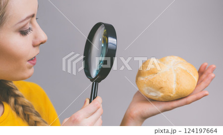 Bun bread roll and magnifying glass 124197664