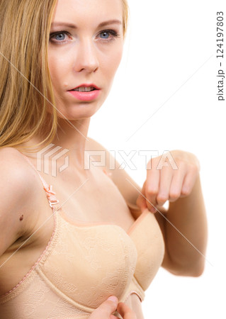Woman wearing too big bra 124197803