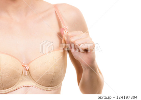 Woman wearing wrong size bra 124197804