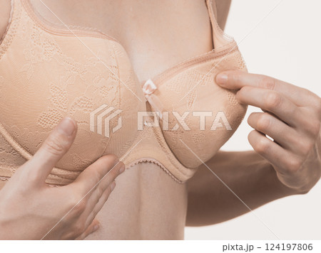 Girl wearing too big bra cup 124197806
