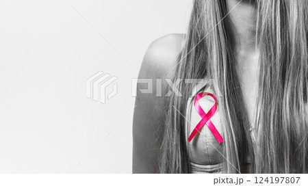 Woman chest in bra, pink cancer ribbon Woman chest in bra, pink cancer ribbon 124197807