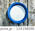 Empty Plate Top View Isolated on wooden Background. 124198096