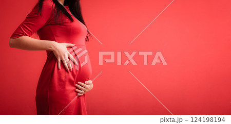 Closeup on tummy of pregnant woman 124198194