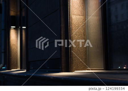 Illumination of the granite-marble facade of the old building late at night 124199334