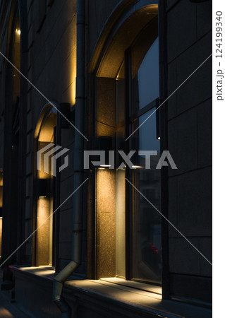 Illumination of the granite-marble facade of the old building late at night 124199340