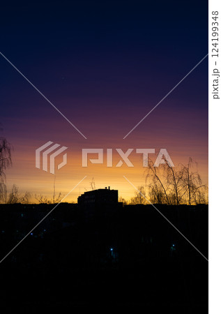 Sunset in the city. The gradient of colors from yellow to purple 124199348