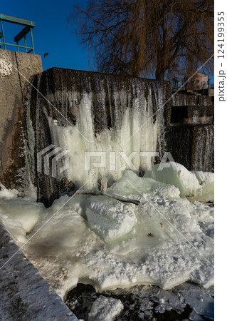 Frozen waterfall water. A frozen waterfall on a February morning Frozen waterfall water. A frozen waterfall on a February morning 124199355