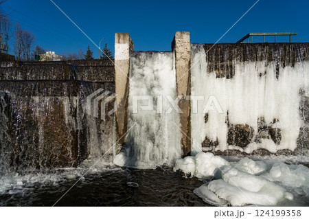 Frozen waterfall water. A frozen waterfall on a February morning Frozen waterfall water. A frozen waterfall on a February morning 124199358