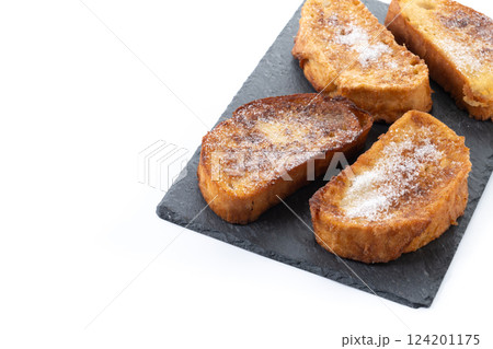 Traditional Spanish torrijas for Holy Week isolated on white background Traditional Spanish torrijas for Holy Week isolated on white background 124201175
