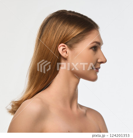 Side profile of elegant woman with smooth skin, neck and bare shoulders, balanced facial proportions isolated on white background. 124201353