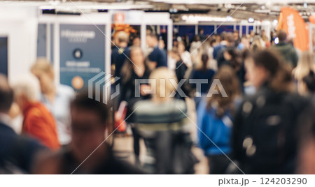 Abstract blurred people at exhibition hall of expo event trade show. Business convention show or job fair. Business concept background 124203290