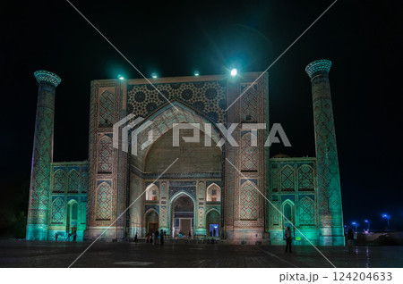 Ulugbek Madrasah on Registan Square with festive evening color lighting. Samarkand, Uzbekistan. 124204633