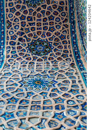 Majolica tile pattern on a madrasah. Samarkand, Uzbekistan. An example of the art of Central Asia. 124204642