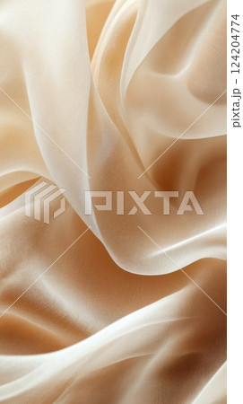 Soft and delicate fabric drapes gracefully on a flat surface creating elegant folds and textures 124204774