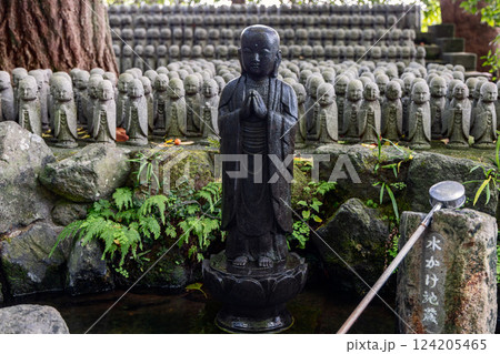 Black stone Jizo figure at Hase-dera temple Kamakura Japan Black stone Jizo figure at Hase-dera temple Kamakura Japan 124205465