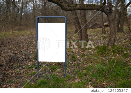 Empty Billboard in a Forest with Blank Space for Advertisement. Park indications and regulations. 124205847