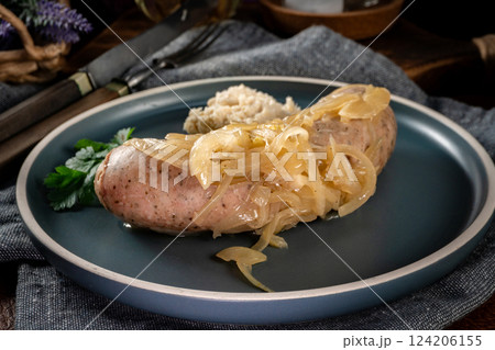 Fried white sausage with onions. 124206155