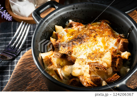Ramekin with delicious casserole. 124206367