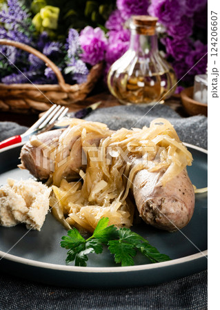 Fried white sausage with onions. Fried white sausage with onions. 124206607
