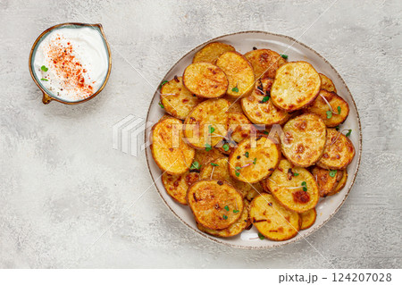 Crispy potato slices, with parmesan cheese and spices, fried in the oven, homemade, no people, Crispy potato slices, with parmesan cheese and spices, fried in the oven, homemade, no people, 124207028