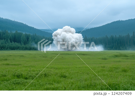 large explosion in the middle of a meadow in the mountains. large explosion in the middle of a meadow in the mountains. 124207409