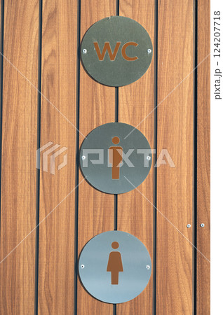 Modern restroom signs blend functionality and design, highlighting accessibility and gender inclusivity at a public space in a contemporary urban environment 124207718