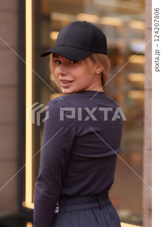Young fashion blond woman in city park Stylish female model in white long sleeve shirt Young fashion blond woman in city park Stylish female model in white long sleeve shirt 124207806