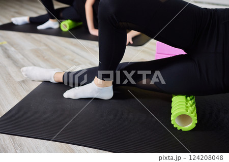 Myofascial release,Massaging fascia calf muscles with myofascial roll,fitness,self-care,health,smart fitness.Myofascial relaxationmuscles foot with a massage ball mat at home,smart fitness,mfr 124208048
